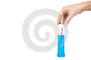 Blue soap bubble bottle with hand isolated on white background, copy space template