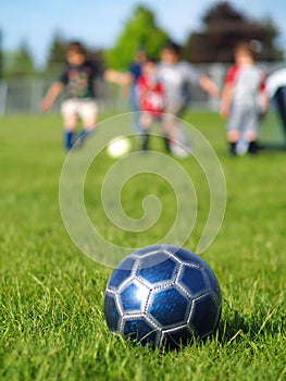 Blue Soccer Ball and Players