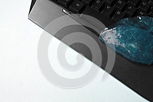 Blue soft gel cleaning dust on keyboard