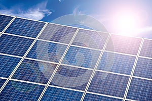 Blue solar cells, blue sky and sun