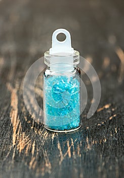 Blue spangles in a bottle