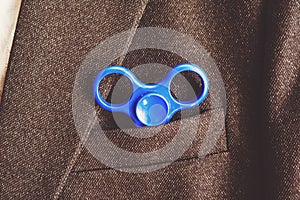 Blue spinner in the pocket of the blazer business businessman