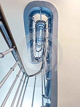 Blue Spiral Staircase Paris. Entrance in France with a cornflower blue staircase. Bottom view