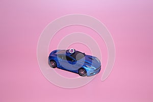 The blue sports car bears a ring with a crystal heart