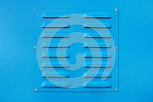 Blue square metal ventilation grate, square shape, new, close view, delivers fresh air and cools
