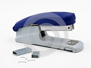 Blue stapler with staples isolated on a white background