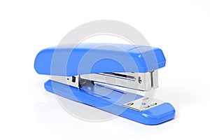 Blue stapler on white background.