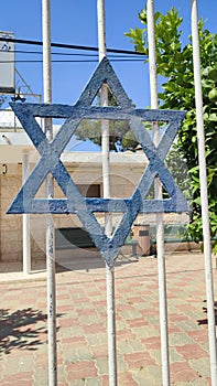 blue star magendavid, symbol of Israel, metal lattice, decoration entrance to the synagogue