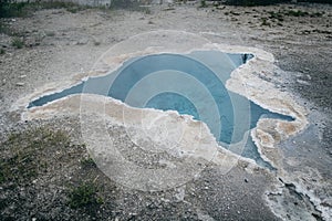 Blue Star Spring near Old Faithful geyser at dusk in Yellowstone National Park