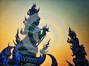 Blue Statue at Rong Sue Ten temple chaing rai in evening