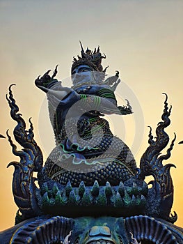Blue Statue at Rong Sue Ten temple chaing rai in evening
