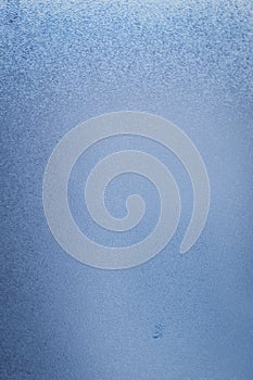 Blue steam condensation on a glass - freshness abstract