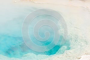 Blue Steaming Hot Water Pool At Geyser Basin In Yellowstone National Park