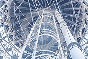 Blue steel water tower. Metal. Metal structures. Perspective.