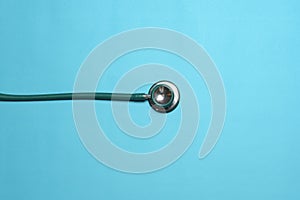 Blue Stethoscope against blue background