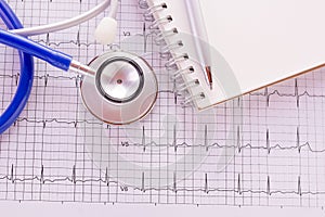 Blue stethoscope and cardiogram pulse trace concept