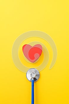 Blue stethoscope with red heart, medical care design concept