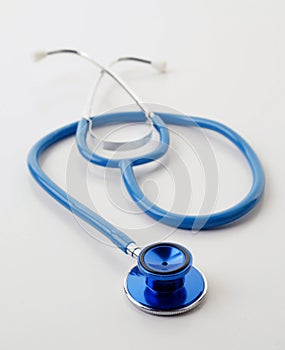 Blue stethoscope on white