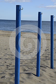 Blue sticks on beach