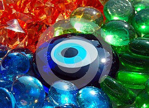 Blue stone eye on coloured glass stones