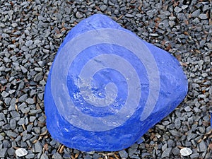 Blue stone in a garden on grit