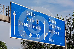 A blue street sign on the autobahn