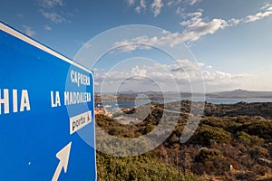 Blue street sign giving direction to Caprera and La Maddalena