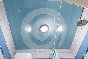 Blue stretch ceiling in bathroom