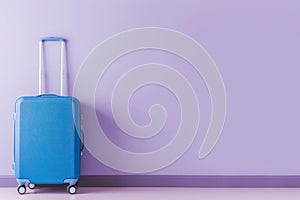 a blue suitcase is leaning against a purple wall