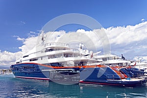 Blue super yachts in a marina