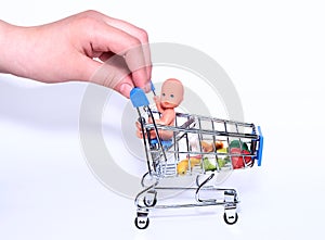 A blue supermarket grocery cart on an isolated white background with fruits and vegetables