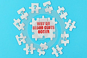 On a blue surface are puzzles with a question mark, in the center with the inscription - why do blood clots occur