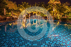 blue swimming pool with light reflections at night