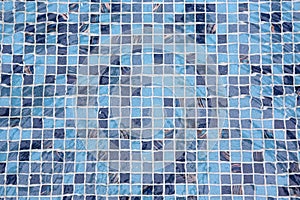 Blue swimming pool with ripple water