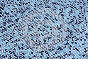 Blue swimming pool with ripple water