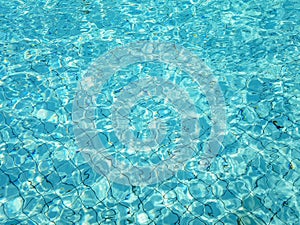 Blue swimming pool rippled water background