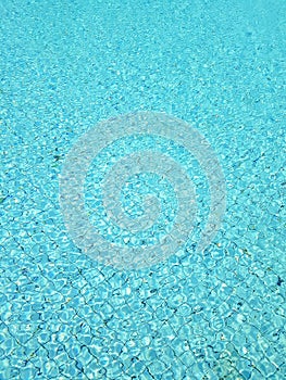 Blue swimming pool rippled water background