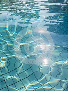 Blue swimming pool rippled water background