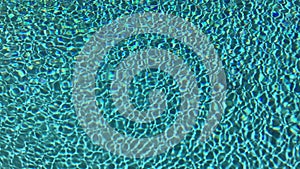 Blue swimming pool rippled water detail