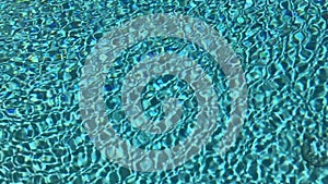 Blue swimming pool rippled water detail