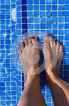 Blue swimming pool water rippled detail