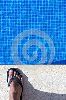 Blue swimming pool water rippled detail