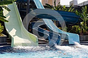 Blue swimming pool with water slide