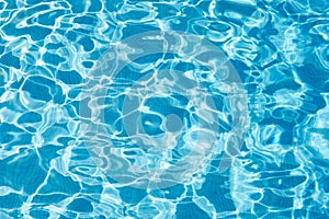 Blue swimming pool water texture background