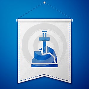 Blue Sword in the stone icon isolated on blue background. Excalibur the sword in the stone from the Arthurian legends
