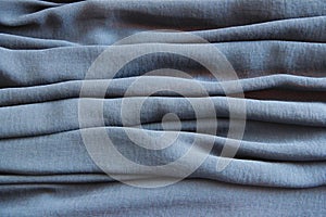 blue synthetic fabric with pleats