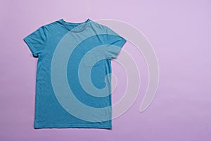 Blue t shirt and copy space on purple background