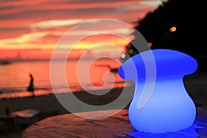 Blue table lamp in a beach cafe at sunset, Boracay Island, Philippines