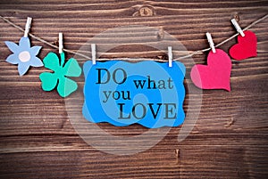 Blue TagWith Phrase Do What You Love On It Hanging on a Line