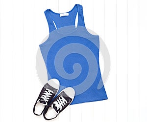 Blue tank top with sneakers on a white background